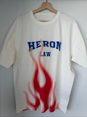 Heron Preston White Tee with Blue HERON Text and Red Flame Graphic
